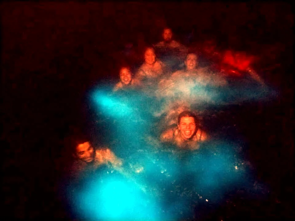 Guests in glowing bioluminescent water